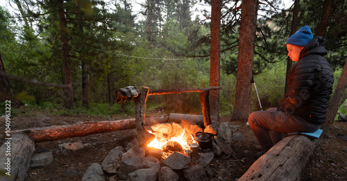 Boy at campfire in evening  photo