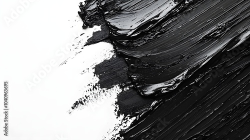 Close-up of abstract black paint strokes with visible brush textures, set against a light background, offering a clean space for text in the center