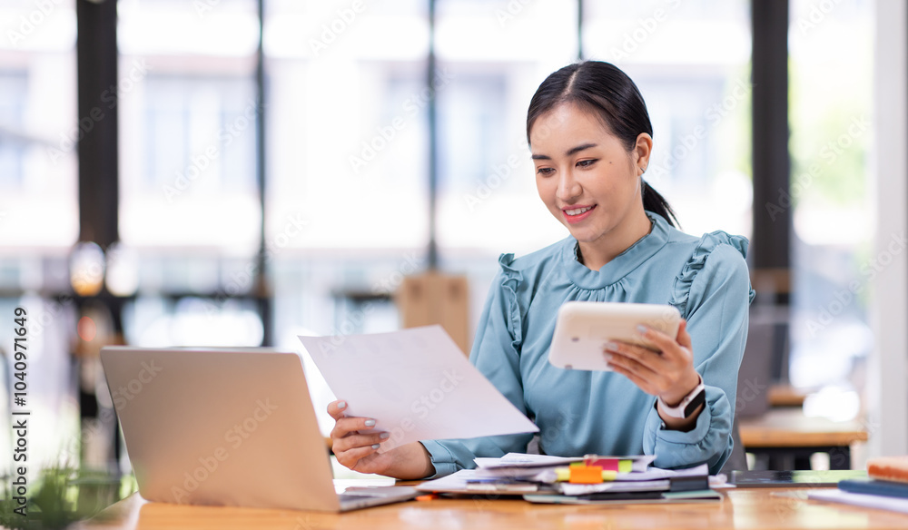 asian business woman or auditor examining documents,Professional scrutinizes financial documents reports, detail-focused work concept
asian business woman or auditor examining documents,Professional scrutinizes financial documents reports, detail-focused work concept