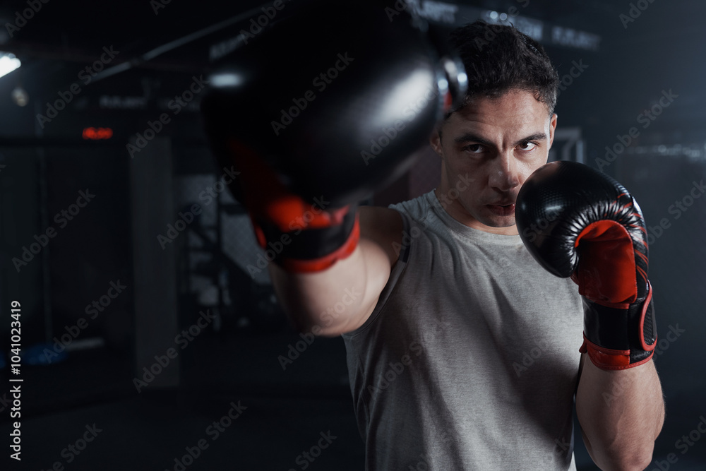 Gym, man and fist with gloves for boxing, mma workout and preparation for fight competition. Fitness club, male person and boxer with power for punch, resilience and combat training for challenge Gym, man and fist with gloves for boxing, mma workout and preparation for fight competition. Fitness club, male person and boxer with power for punch, resilience and combat training for challenge