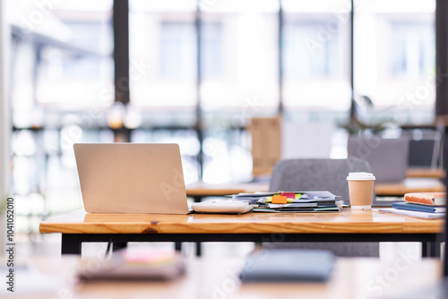 Wallpaper Mural Laptop Computer, notebook, and eyeglasses sitting on a desk in a large open plan office space after working hours	
 Torontodigital.ca