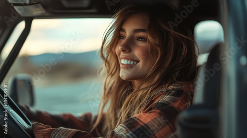 Smiling woman looking away while sitting in sports utility vehicle