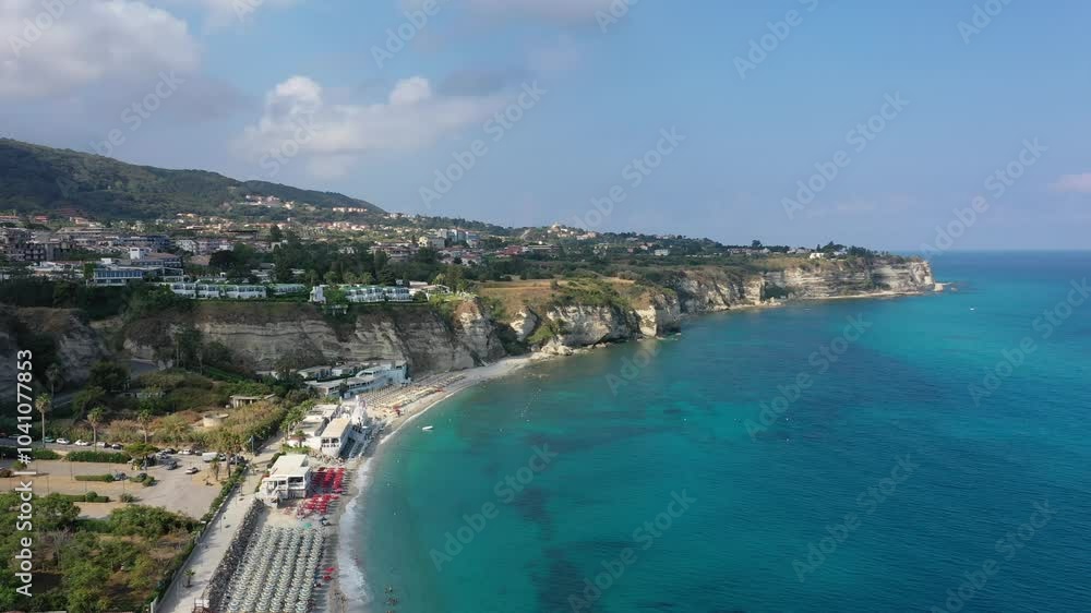 Aerial view of the coastline, sea and sandy beaches of Tropea on a sunny summer day in Calabria, Italy Aerial view of the coastline, sea and sandy beaches of Tropea on a sunny summer day in Calabria, Italy