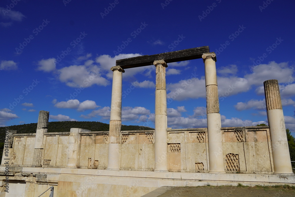 Fototapeta premium Ruins of the colonnade over the underground Avaton, where patients were healed by the god Asclepius in the Epidavros archaeological site