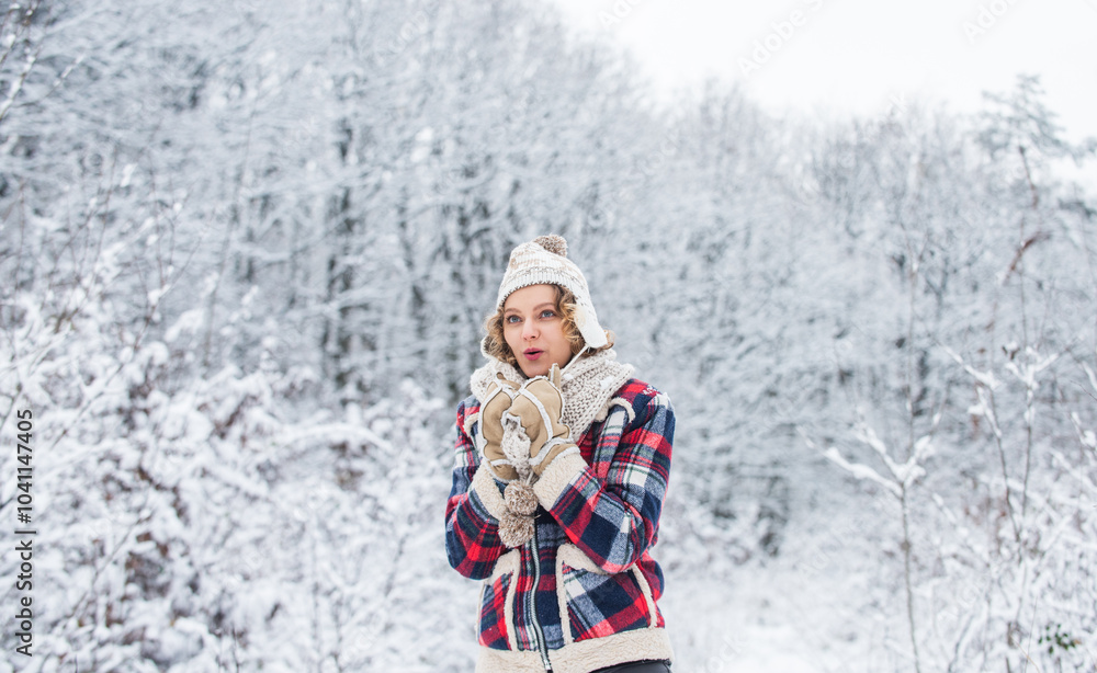 Fototapeta premium Favorite season. Enjoy every snowflake. Winter outfit. Woman wear warm accessories stand in snowy nature. Winter fashion collection. Cheerful emotional girl having fun outdoors. Winter admirer