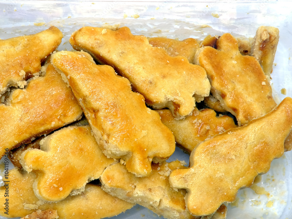 Dry peanut cake is made from coarsely blended peanut butter and peanuts which are baked in the oven. A snack food that is usually made during big holidays in Indonesia. Dry peanut cake is made from coarsely blended peanut butter and peanuts which are baked in the oven. A snack food that is usually made during big holidays in Indonesia.