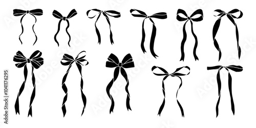 A series of black bows are shown in various positions. The bows are all different sizes and are arranged in a row. Concept of elegance and sophistication, as the bows are all neatly aligned