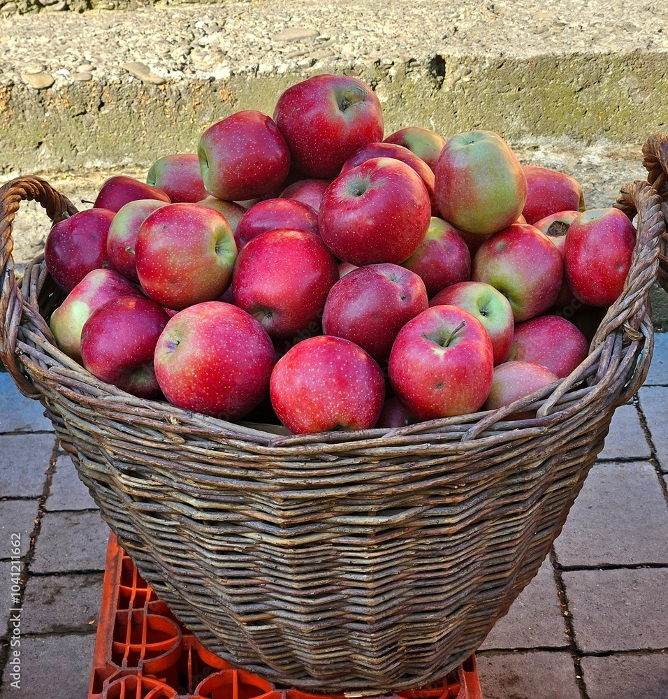 Apple on the big basket. Autumn apples in a rustic basket, red apples in a basket