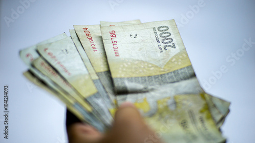 Some 2000 rupiah notes that look a bit worn