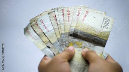 Some 2000 rupiah notes that look a bit worn