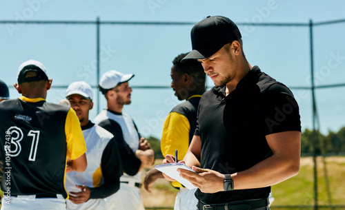 Men, baseball coach and writing with team for game plan, strategy or roster in match, tournament or competition. Young, group or players with trainer or referee taking notes of formation on pitch