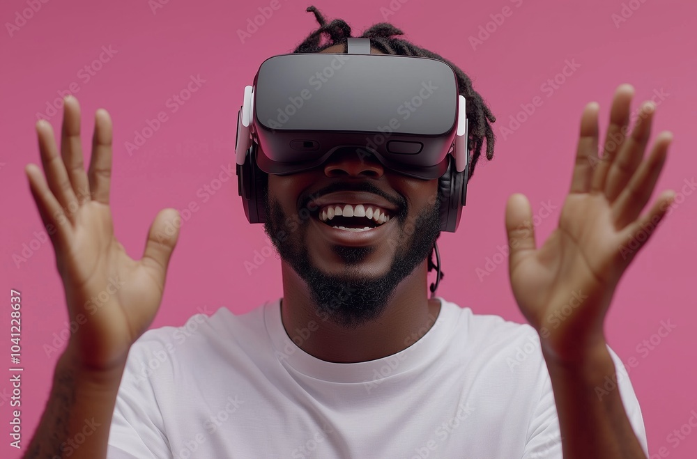 A man wearing a white shirt and black hair is wearing a virtual reality headset. He is smiling and his hands are raised A man wearing a white shirt and black hair is wearing a virtual reality headset. He is smiling and his hands are raised