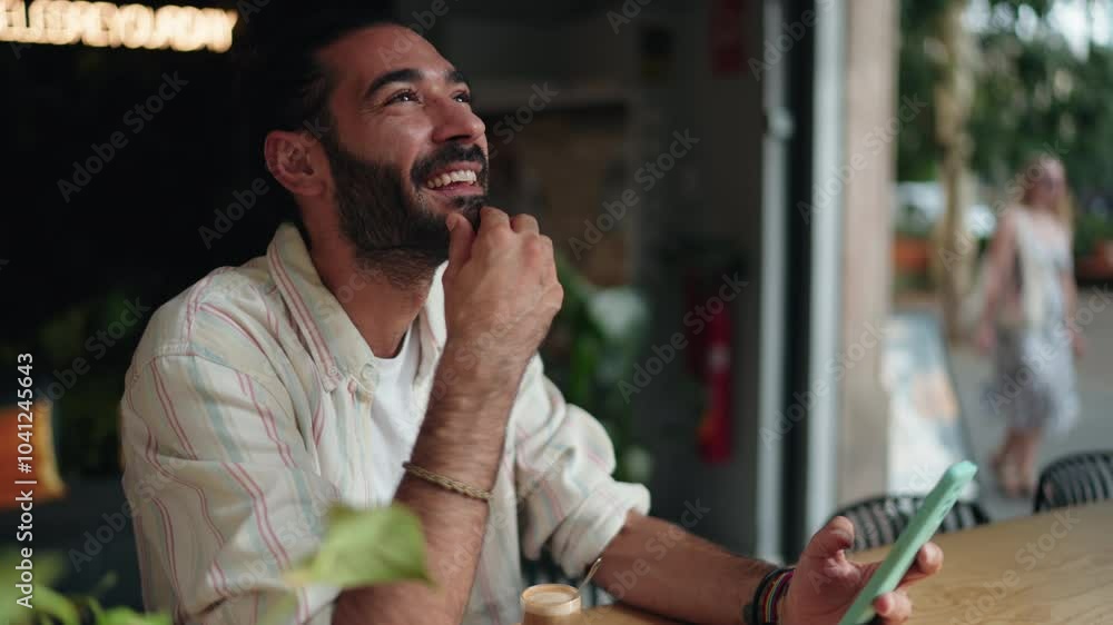 Man laughing and enjoying fun conversation while chatting on smartphone in a café. relaxed atmosphere emphasizes connection, humor, and joy of digital communication through messaging smartphone apps
Man laughing and enjoying fun conversation while chatting on smartphone in a café. relaxed atmosphere emphasizes connection, humor, and joy of digital communication through messaging smartphone apps