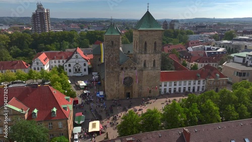 Aerial view of Osnabruck city center and Saint Peter Cathedral standing out in the urban landscape. Sunny Day in Germany photo