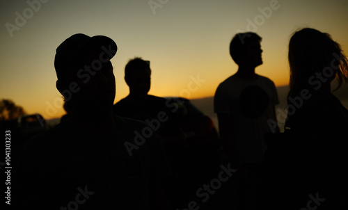 Silhouette, people and sunset on hill outdoor for sightseeing, horizon scenery and view of environment. Group, friends and mockup on mountain at night for holiday, travel or summer vacation in nature