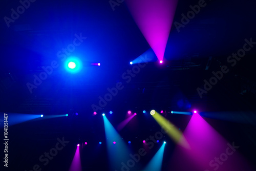 Colorful concert lights on empty stage