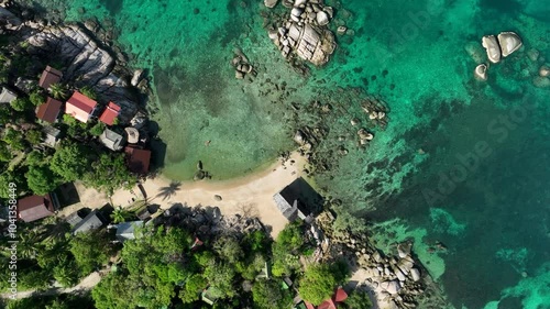 Kayaker in the bay of Sai Nuan Beach in Koh Tao, Thailand. photo