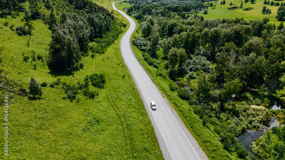 the car is driving along a mountain road in Altai the car is driving along a mountain road in Altai