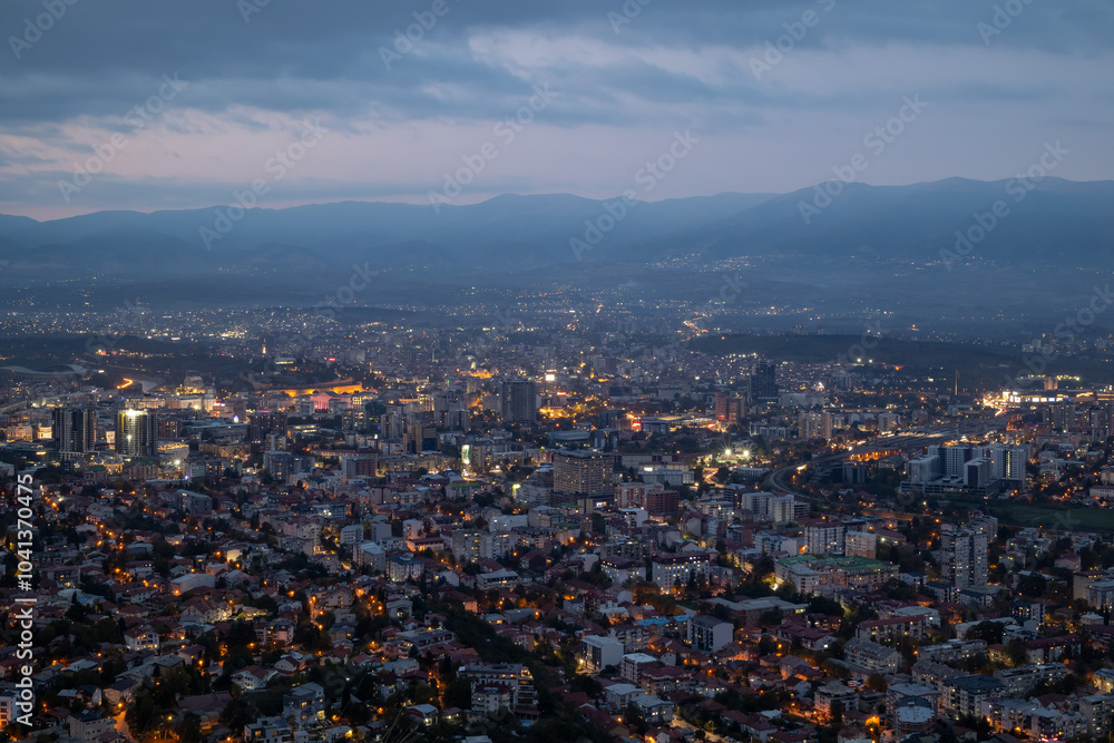 Obraz premium City illuminated at dusk, seen from above. The European capital of North Macedonia, Skopje.