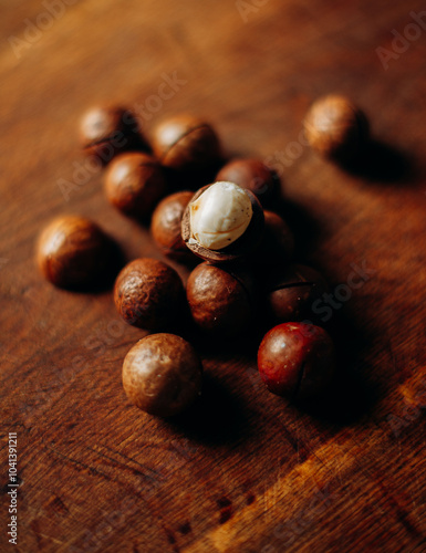 Organic Macadamia nut on wooden table photo