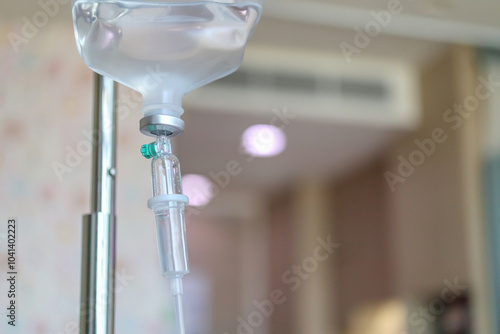 Close up medical intravenous IV drip in hospital background