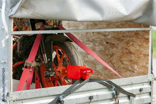 motorcycle strapped in a trailer