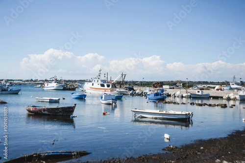 fishing boats in harbour in Portopalo in Sicily photo