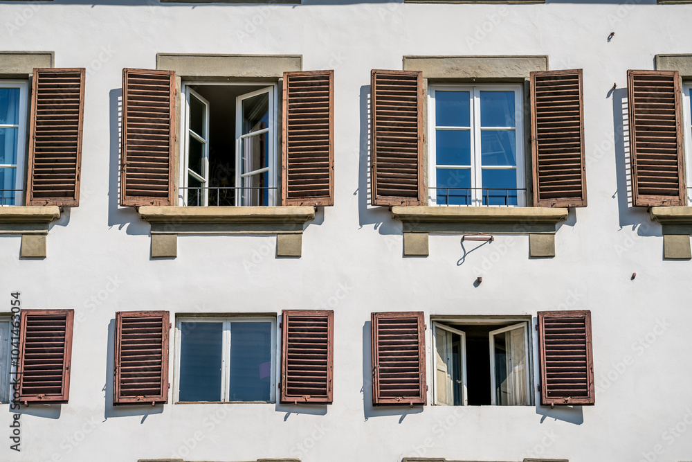 Facade of a modern Italian style building with many identical windows Facade of a modern Italian style building with many identical windows