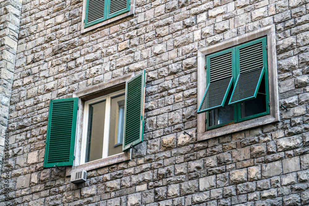 Fototapeta premium Italian style windows with green wooden shutters