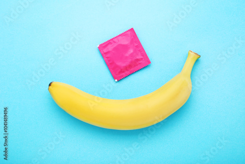 Obraz na płótnie Banana with condom on blue background w salonie