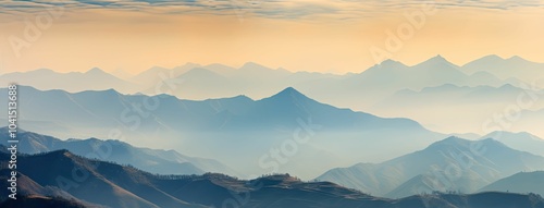 Misty mountain ranges at sunrise.