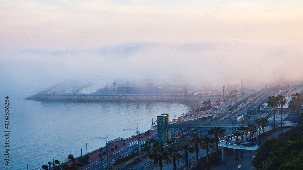 View of the city by the sea and Morning fog over the sea
