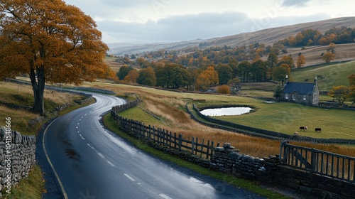 Rain falls heavily on a winding country road in England, bordered by vibrant grass and trees, creating a serene yet moody ambiance photo