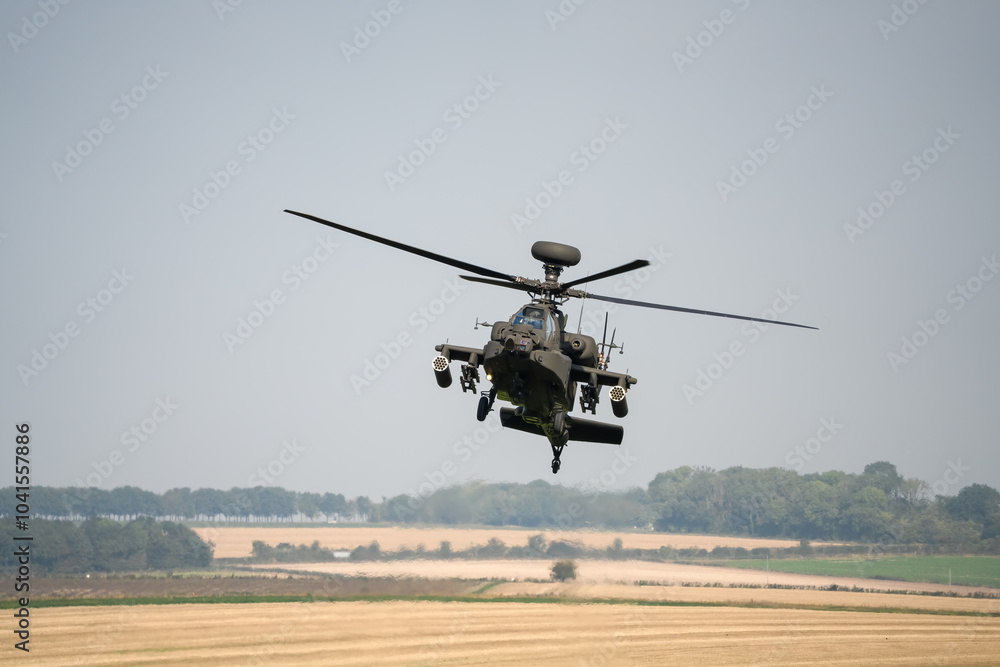 close-up front view of a British army Boeing Apache Attack helicopter gunship AH64E AH-64E ArmyAirCorp in low level flight