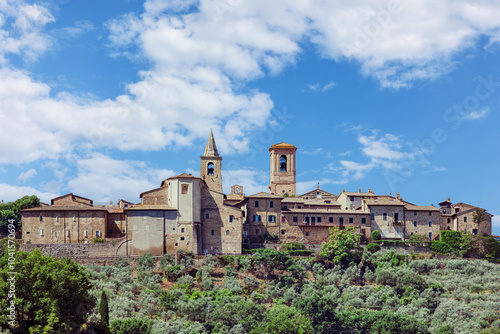 Obraz na płótnie Collemancio, a historic hamlet in Cannara, Umbria, showcases its medieval architecture against a backdrop of rolling hills and olive groves on a sunny day. w salonie