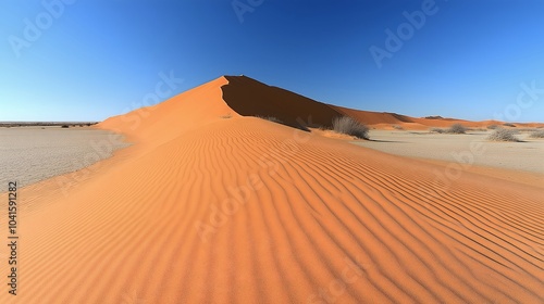 Fototapeta Naklejka Na Ścianę i Meble -  Sand dunes in the desert, blue sky, tall ridge wind blown dune landscape.