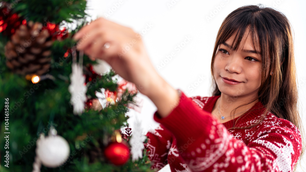 Merry christmas and happy holidays, asian woman decorating tree with snowflake Merry christmas and happy holidays, asian woman decorating tree with snowflake