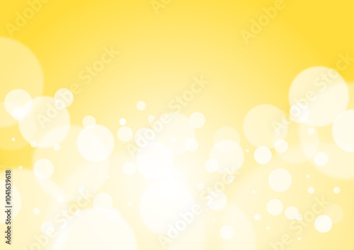 黄色のグラデーションにキラキラしたシャボンボケの背景　Sparkling soap bokeh background with yellow gradation