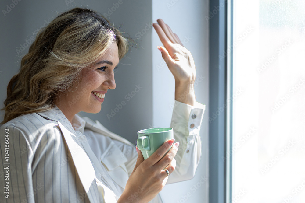 Smiling Woman Enjoying Coffee By Bright Window Smiling Woman Enjoying Coffee By Bright Window