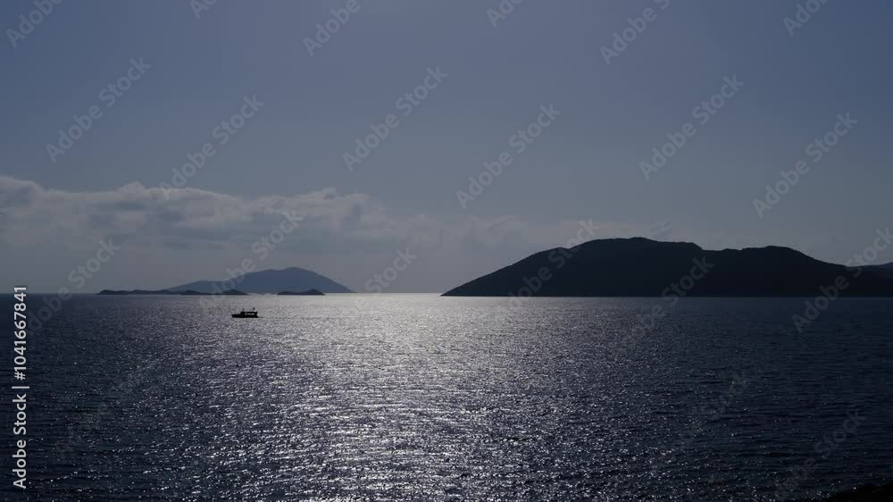 view from the coast near the town of Kas to the islands and boats in the open sea. Turkish resort on Mediterranean sea view from the coast near the town of Kas to the islands and boats in the open sea. Turkish resort on Mediterranean sea