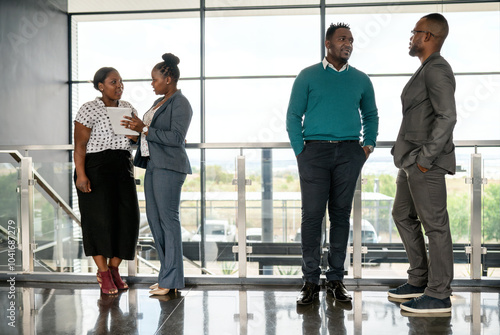 Professional African Business Team Engaged in Conversational Meeting