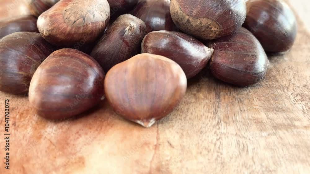 Chestnuts on the table freshly harvested from the forest.
Chestnuts on the table freshly harvested from the forest.