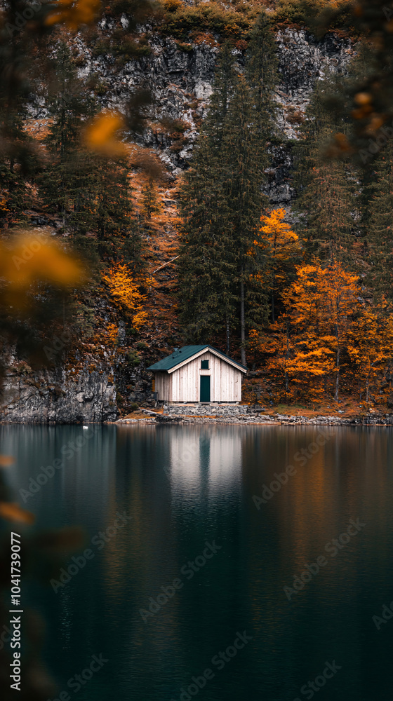Chalet near a lake, A lake house between the trees in breathtaking nature. The house in the greenery near the lake.  Reflected on water. Country side, forest and lake with house.
