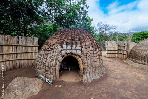 Traditional village huts in Eswatini showcase cultural heritage and craftsmanship amid a serene landscape