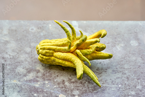 Buddha's hand lemon on a rustic background photo