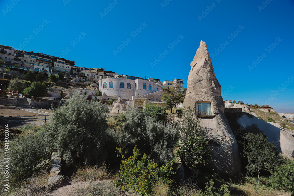 Exploring the unique rock formations and fairy chimneys of Cappadocia under bright sunlight Exploring the unique rock formations and fairy chimneys of Cappadocia under bright sunlight