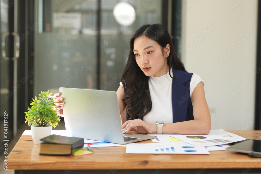 Asian woman succeeds at office