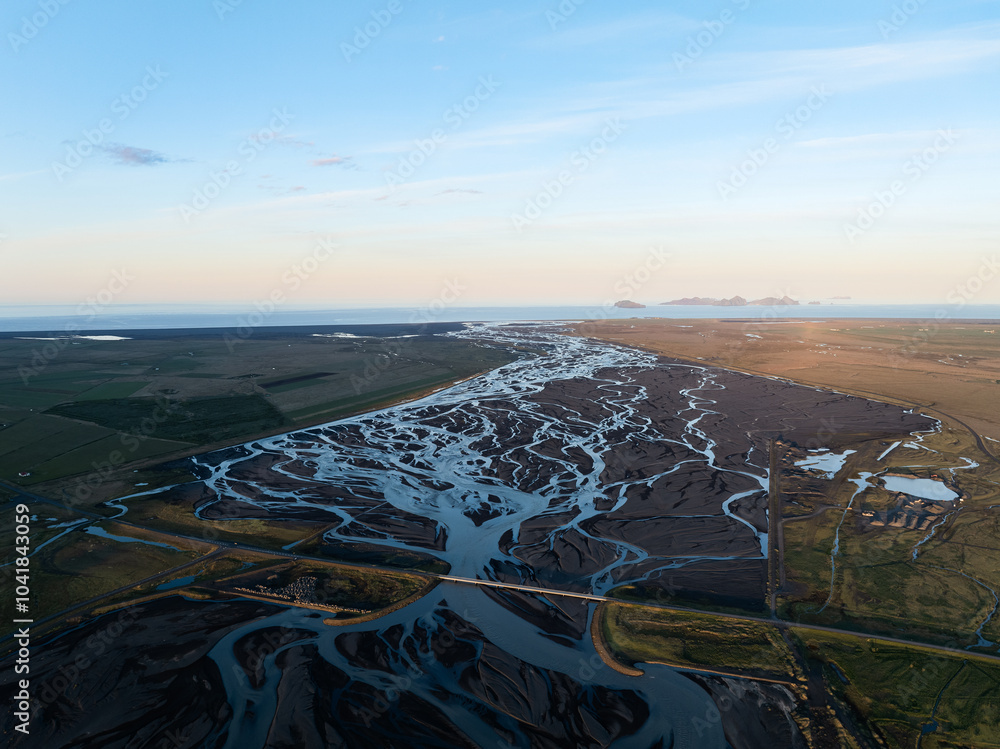 View from above, stunning landscape with a patterns created in the volcanic sands of Iceland as glaciers melt the water flows as rivers out to sea. Natural pattern, wallpaper.