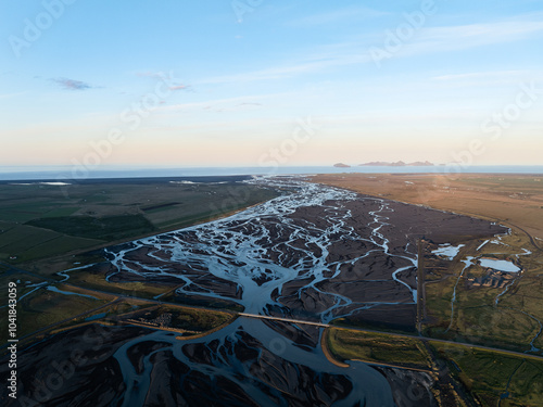 Obraz na płótnie View from above, stunning landscape with a patterns created in the volcanic sands of Iceland as glaciers melt the water flows as rivers out to sea. Natural pattern, wallpaper. w salonie