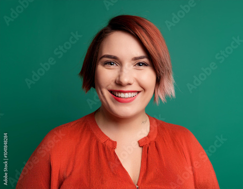 Portrait of Beautiful Young Woman Happily Smiling Against Studio Background